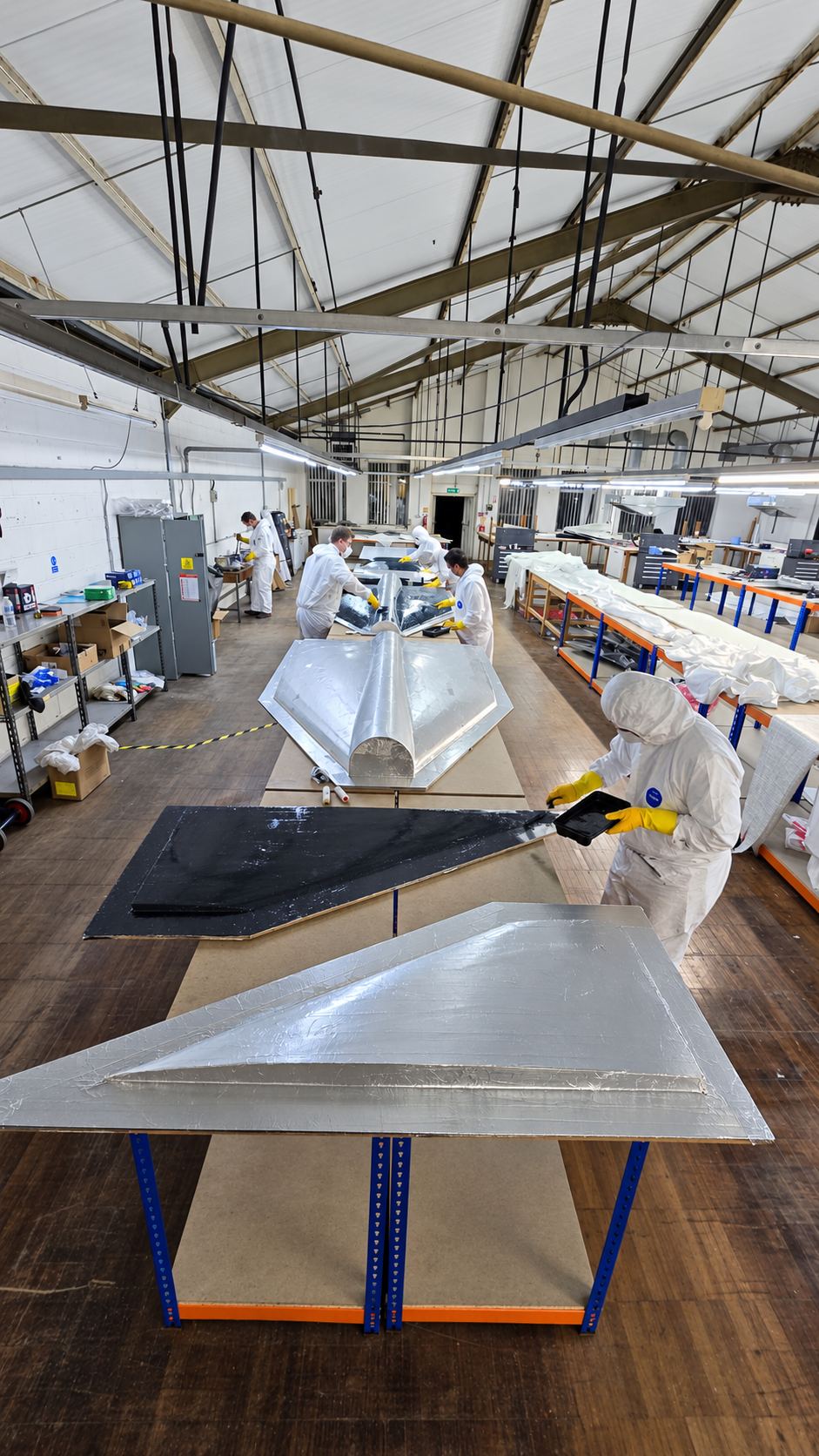 Composite layup team working on an airframe skin
